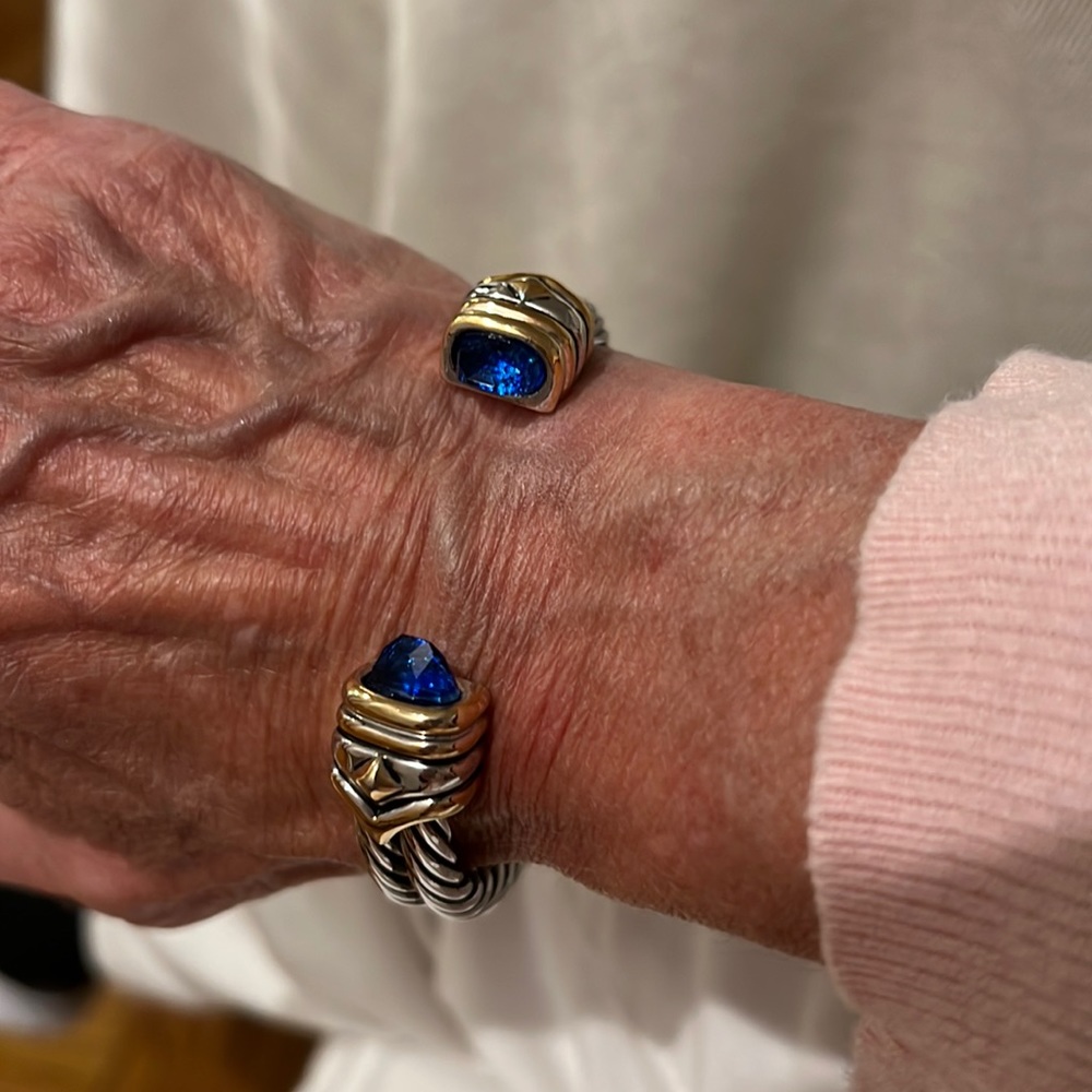 Costume cuff bracelet with blue stones.